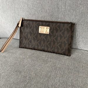Michael Kors wrist clutch monogram pattern